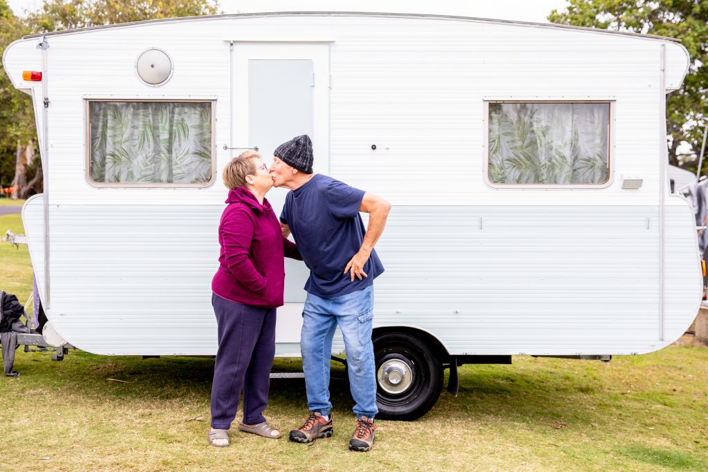 Grandparents with grandkids at campground with their caravan